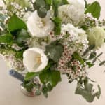 white, dark green, and light green floral arrangement